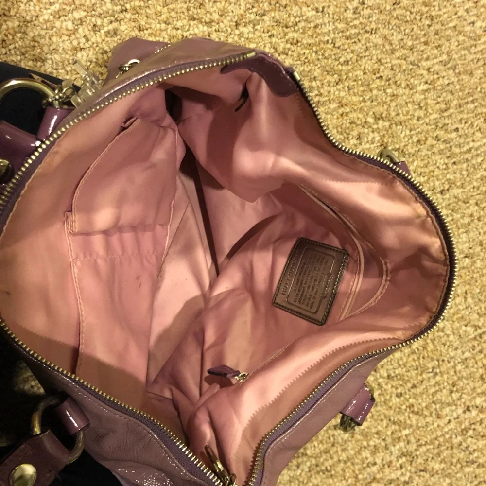 Lavender Coach tote bag.